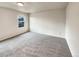 Simple carpeted bedroom with a window at 10968 Grange Creek Dr, Thornton, CO 80233