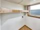 Laundry room with shelving, window and tile flooring at 10968 Grange Creek Dr, Thornton, CO 80233