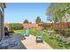 Backyard featuring a seating area, mature trees, and lawn at 16519 E Hialeah Dr, Centennial, CO 80015