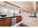 Finished basement with a wet bar and exercise area at 16519 E Hialeah Dr, Centennial, CO 80015