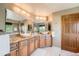Bathroom featuring a double vanity, granite countertops, and white marble floors at 16519 E Hialeah Dr, Centennial, CO 80015