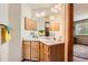 Bathroom with double sink vanity and large mirror at 16519 E Hialeah Dr, Centennial, CO 80015