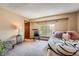 Bedroom featuring a seating area and large window at 16519 E Hialeah Dr, Centennial, CO 80015