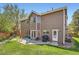 Exterior of home with large backyard and patio area at 16519 E Hialeah Dr, Centennial, CO 80015