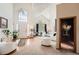 Airy living room featuring high ceilings and large windows at 16519 E Hialeah Dr, Centennial, CO 80015