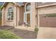 Inviting front porch and arched window add charm to this lovely home at 16519 E Hialeah Dr, Centennial, CO 80015