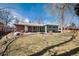 Spacious backyard featuring a lawn, patio, and the rear of the house, perfect for outdoor living at 6930 S Delaware St, Littleton, CO 80120