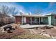 Spacious backyard with patio, grill, and dining set, perfect for outdoor entertaining and relaxation at 6930 S Delaware St, Littleton, CO 80120