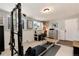 Bonus room featuring pilates reformer, desk, and storage creating a versatile space at 6930 S Delaware St, Littleton, CO 80120