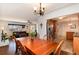 Dining room with hardwood floors adjacent to the kitchen and living area at 6930 S Delaware St, Littleton, CO 80120