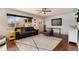 Bright living room features hardwood floors, a picture window, and neutral wall colors at 6930 S Delaware St, Littleton, CO 80120