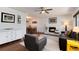 Inviting living room featuring a fireplace, hardwood floors and an abundance of natural light at 6930 S Delaware St, Littleton, CO 80120