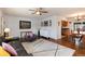 Open concept living room and dining room with hardwood floors and neutral wall colors at 6930 S Delaware St, Littleton, CO 80120