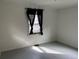 Bedroom featuring wood floors and natural light from the window at 945 Zenobia St, Denver, CO 80204