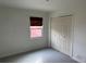 Cozy bedroom featuring a window and closet at 945 Zenobia St, Denver, CO 80204