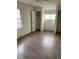 Bedroom featuring wood floors, a closet, and natural light from the window at 945 Zenobia St, Denver, CO 80204