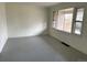 Bright living room with natural light from large windows and painted wood floors at 945 Zenobia St, Denver, CO 80204