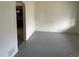 Spacious living room with painted wood floors, flowing into the kitchen at 945 Zenobia St, Denver, CO 80204