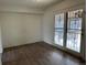 Cozy sun room with wood floors and glass doors leading to outdoor space at 945 Zenobia St, Denver, CO 80204