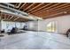 Spacious unfinished basement with exposed ceiling, large sliding doors, and ample potential at 7658 S Country Club Pkwy, Aurora, CO 80016