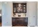 Charming dining area with dark wood built-ins, countertop, and elegant decor at 7658 S Country Club Pkwy, Aurora, CO 80016