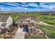 Beautiful two-story home overlooking a manicured golf course and lush landscaping at 7658 S Country Club Pkwy, Aurora, CO 80016