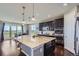 Modern kitchen with granite countertops, stainless steel appliances and island seating at 7658 S Country Club Pkwy, Aurora, CO 80016