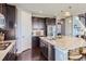 Well-equipped kitchen with stainless appliances, center island, and ample cabinet space at 7658 S Country Club Pkwy, Aurora, CO 80016