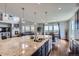 Open concept kitchen with an expansive island and adjacent breakfast nook at 7658 S Country Club Pkwy, Aurora, CO 80016