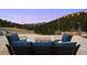 Spacious stone patio offers amazing mountain views and an outdoor gathering area at 21609 Clarence Ln, Golden, CO 80401