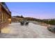 Backyard patio with stone work and string lights creates an idyllic space for relaxation at 21609 Clarence Ln, Golden, CO 80401