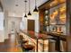 Stylish bar area with illuminated countertop, comfortable seating, and a sleek beverage cooler at 21609 Clarence Ln, Golden, CO 80401