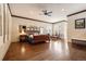 Spacious bedroom boasts hardwood floors, stylish trim, and a seating area with bright natural light at 21609 Clarence Ln, Golden, CO 80401