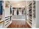 Organized walk-in closet featuring custom shelving and plenty of storage space at 21609 Clarence Ln, Golden, CO 80401