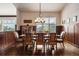Elegant dining room with wainscoting, large window, and scenic views, perfect for entertaining guests at 21609 Clarence Ln, Golden, CO 80401