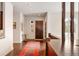 Bright foyer features hardwood floors, wooden door and trim, area rug, and modern design elements at 21609 Clarence Ln, Golden, CO 80401