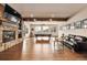 Large game room with pool table, fireplace, comfortable seating, and bright natural light at 21609 Clarence Ln, Golden, CO 80401