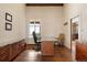 Bright home office with custom built-ins and a large window offering natural light and scenic views at 21609 Clarence Ln, Golden, CO 80401