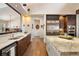 Bright open kitchen features stainless steel appliances, granite countertops, and hardwood floors at 21609 Clarence Ln, Golden, CO 80401