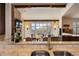 Open concept living room view from the kitchen featuring large windows and beautiful mountain views at 21609 Clarence Ln, Golden, CO 80401