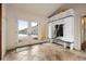 Sun-drenched mud room with built-in storage, bench, coat hooks, and tiled floors, and a view to the outside at 21609 Clarence Ln, Golden, CO 80401