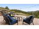 Outdoor patio featuring comfortable seating and string lights with panoramic views of surrounding landscape at 21609 Clarence Ln, Golden, CO 80401