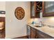 Stylish wine bar with granite countertops, wine fridge, and custom cabinetry, great for entertaining at 21609 Clarence Ln, Golden, CO 80401