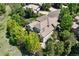 Rear aerial of a private backyard with mature landscaping at 9278 E Aspen Hill Pl, Lone Tree, CO 80124