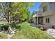 Spacious backyard with lush greenery, trees, and well-maintained landscaping for outdoor enjoyment at 9278 E Aspen Hill Pl, Lone Tree, CO 80124