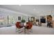Finished basement with dining area, fireplace, built-in shelving, and a walkout patio at 9278 E Aspen Hill Pl, Lone Tree, CO 80124