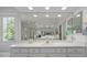 Bathroom featuring a large mirror, white vanity, and plenty of counter space at 9278 E Aspen Hill Pl, Lone Tree, CO 80124