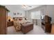 Cozy bedroom featuring a floral bedspread, a wooden armoire, and a window with natural light at 9278 E Aspen Hill Pl, Lone Tree, CO 80124