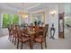 Well-lit dining area featuring a large window and classic design at 9278 E Aspen Hill Pl, Lone Tree, CO 80124