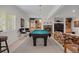 Basement featuring a pool table, fireplace, and built-in shelving at 9278 E Aspen Hill Pl, Lone Tree, CO 80124
